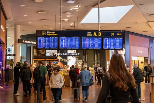 Copenhagen International Airport information board with flight information. Copenhagen, Denmark - December 12, 2024