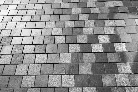 Gray cobblestone footpath. Tile background