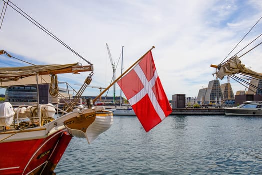Copenhagen, Denmark - May 15, 2023. Danish flag on the mast of the yacht in Copenhagen. High quality photo