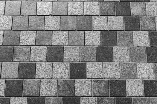 Gray cobblestone footpath. Tile background