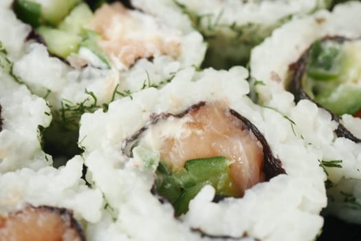 A delicious savory sushi platter showcasing exquisite salmon alongside fresh vegetable rolls