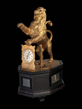 A close-up of an antique German automaton clock in the form of a lion, crafted in Augsburg around 1620-35, with intricate details and a mechanical movement.