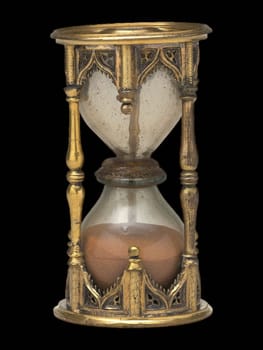 antique German brass half-hour sandglass with intricate gothic details.