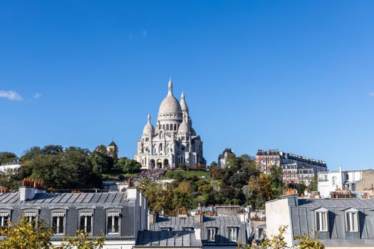 View from above of Paris and the hill of Montmartre and the Sacre Coeur Cathedral. Paris, France - November 15, 2024