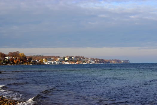 Coastline with houses at the Danish coast. View to beautiful landscape. North sea coast. House by the sea.
