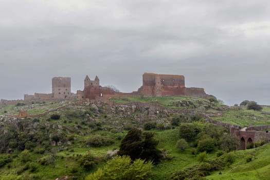 Beautiful view of ancient ruins Hammershus in cloudy weather on the island Bornholm, Denmark. High quality photo