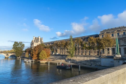 Beautiful cityscape with view of the Seine River and the Louvre Palace. Paris, France - November 1, 2024