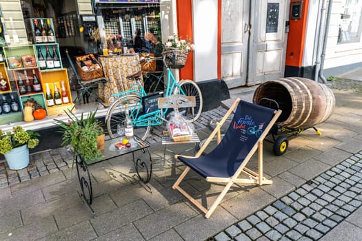 French wine shop window and street decorations outside the shop, Helsingor Denmark - September 17, 2024.