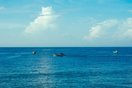 Sea sky cumulus cloud landscape view background. Calm water alone fishing boat. Destination aim progress concept.