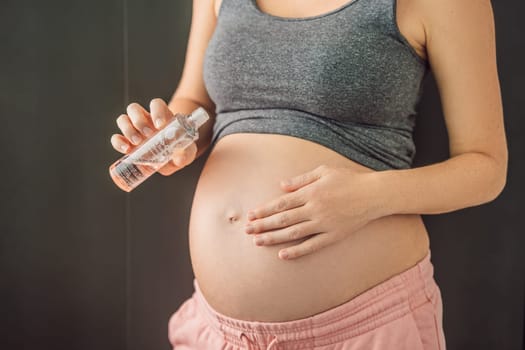 Turkiye, Antalya 02.02.2022: Woman holds Bio Oil, a nurturing choice for pregnant women. A soothing image of care and wellness during pregnancy.