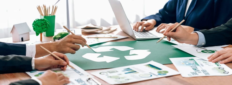 Group of business people planning and discussing on recycle reduce reuse policy symbol in office meeting room. Green business company with eco-friendly waste management regulation concept.Trailblazing