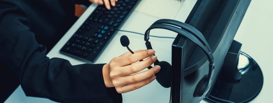 Business people wearing headset working in office to support remote customer or colleague. Call center, telemarketing, customer support agent provide service on telephone video conference oratory call