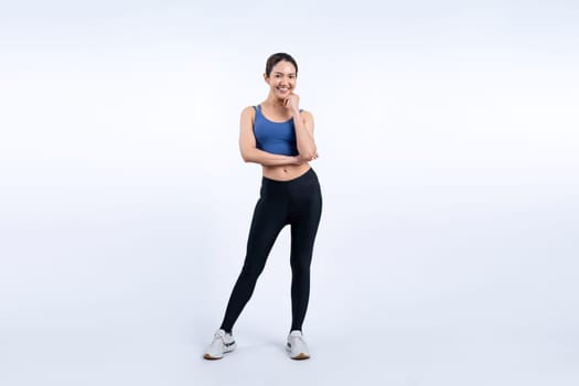 Full body asian woman in sportswear portrait, smiling and posing cheerful gesture. Workout training with attractive girl engage in her pursuit of healthy lifestyle. Isolated background Vigorous