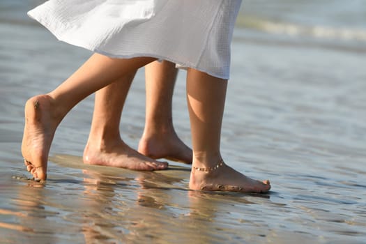 Sand on the feet and heels on the coast