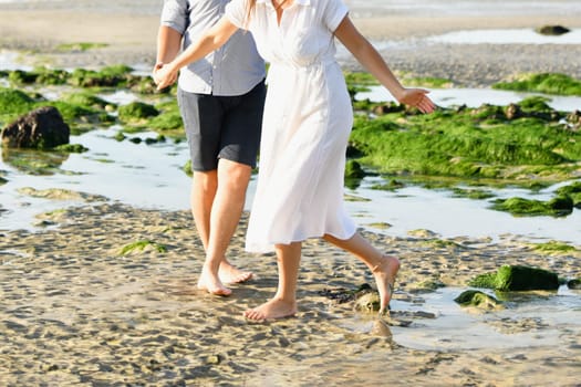 Couple running on the Atlantic ocean