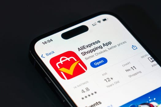 New York, USA - December 20, 2024: AliExpress shopping app displayed on smartphone screen with logo. Global ecommerce application offering products and deals from international sellers