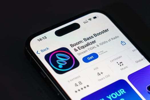 New York, USA - December 20, 2024: Boom app displayed on smartphone screen with logo. Music equalizer application offering bass boosting and sound enhancement features