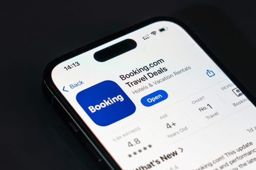 New York, USA - December 20, 2024: Booking.com app displayed on smartphone screen with logo. Travel application for hotel bookings and vacation planning