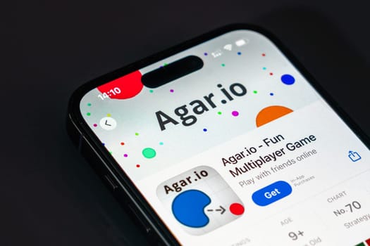 New York, USA - December 20, 2024: Agar.io game app displayed on smartphone screen with logo. Popular multiplayer game focused on strategy and competitive gameplay