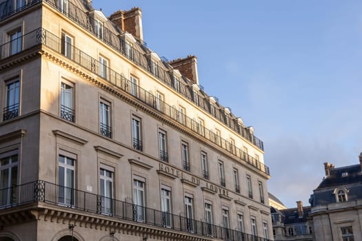 A stunning and historic building that beautifully showcases classic architecture under the warm sunlights glow. Hotel du Louvre Paris, France-October 24, 2024