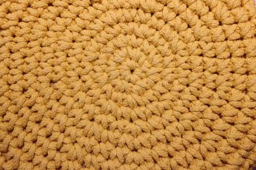 This is a detailed closeup view of a textured yellow crochet pattern, which is simply ideal for home decor inspiration