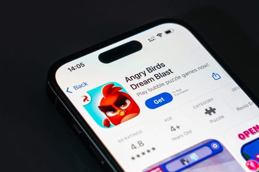 New York, USA - December 20, 2024: Angry Birds Dream Blast game app displayed on smartphone screen with logo. Fun puzzle game featuring colorful bird characters and engaging levels