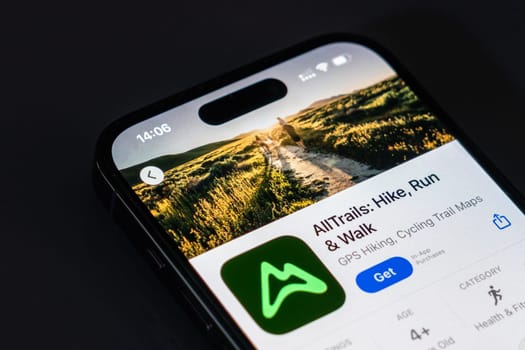 New York, USA - December 20, 2024: AllTrails app displayed on smartphone screen with logo. Outdoor activity application for hiking, running, and exploring nature trails