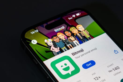 New York, USA - December 20, 2024: Bitmoji app displayed on smartphone screen with logo. Avatar creation application for personalized emojis and stickers