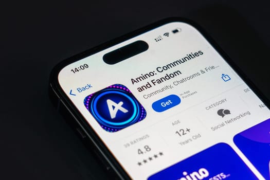 New York, USA - December 20, 2024: Amino app displayed on smartphone screen with logo. Social networking platform for communities, fandoms, and creative collaboration