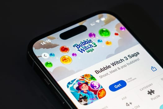 New York, USA - December 20, 2024: Bubble Witch 3 Saga game app displayed on smartphone screen with logo. Popular puzzle game featuring bubble shooting and magical adventures
