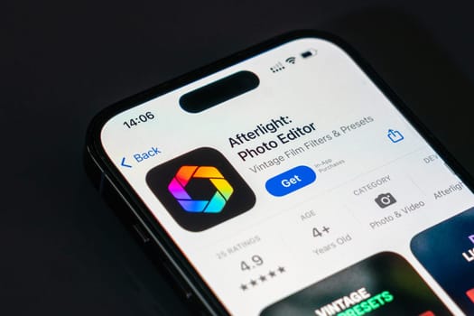 New York, USA - December 20, 2024: Afterlight photo editor app displayed on smartphone screen with logo. Mobile application offering advanced photo editing tools and creative effects