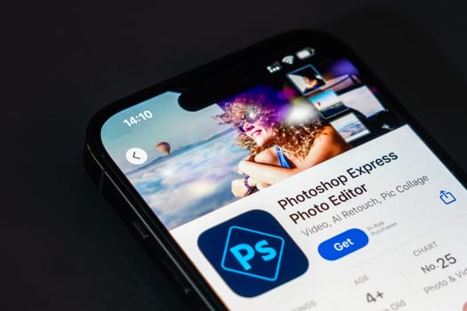 New York, USA - December 20, 2024: Photoshop Express Photo Editor app displayed on smartphone screen. Popular mobile application for photo editing and creative tools
