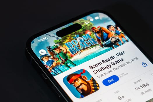 New York, USA - December 20, 2024: Boom Beach game app displayed on smartphone screen with logo. War strategy game featuring base building and tropical battles
