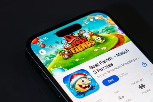 New York, USA - December 20, 2024: Best Fiends game app displayed on smartphone screen with logo. Puzzle adventure game featuring cute characters and engaging levels