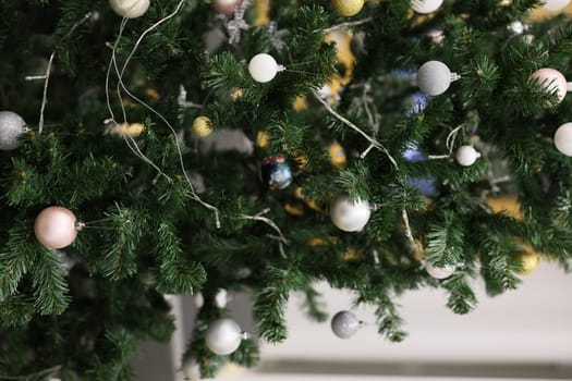 A beautifully decorated Christmas tree featuring elegant ornaments and soft lights, celebrating the holiday spirit.