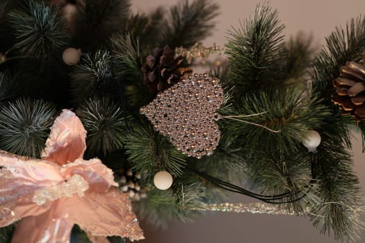 Beautifully arranged holiday decor showcasing pine needles, a delicate heart ornament, and a lovely bow accent