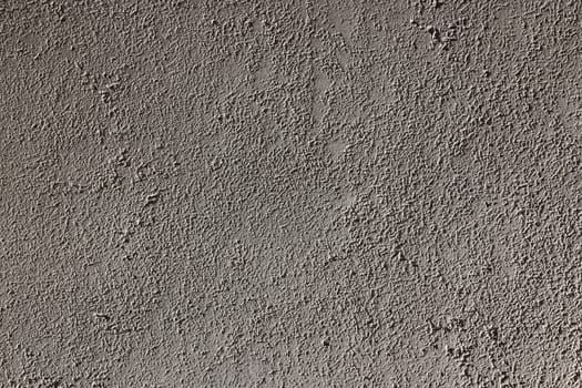 A highly detailed view of a rough gray wall texture, which is perfect for various backgrounds and design themes