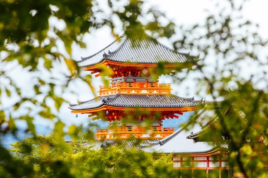 The iconic Kiyomizu-dera temple and mountain view on a sunny spring day in Kyoto, Japan