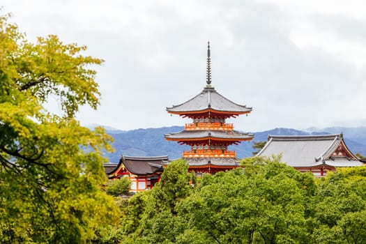 The iconic Kiyomizu-dera temple and mountain view on a sunny spring day in Kyoto, Japan