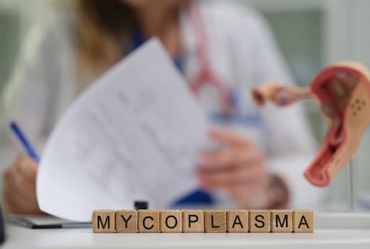 A dedicated medical professional diligently studies mycoplasma, emphasizing its essential role in the healthcare sector
