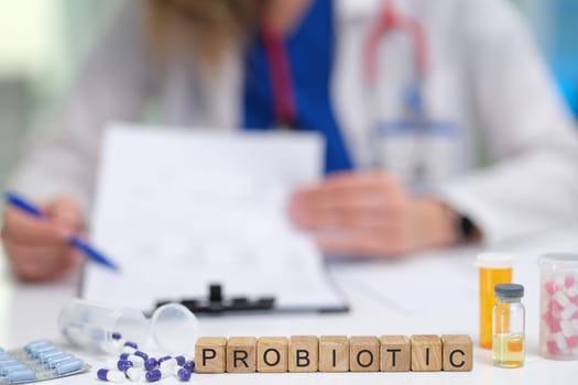 In a clinical setting, a healthcare professional is discussing the various benefits of probiotics with patients