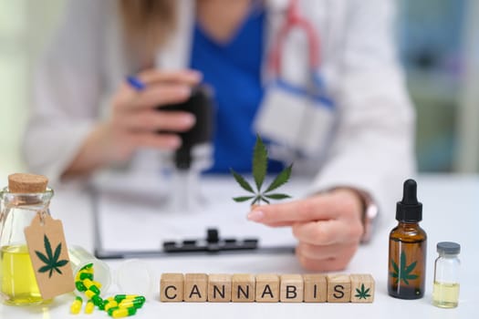 A trained medical professional carefully examines various cannabis products for their therapeutic use and benefits