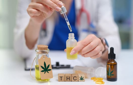 A healthcare expert is demonstrating the process of THC oil extraction and its applications in clinical usage