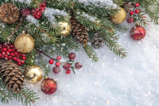 Festive Christmas and New Year Decoration with Snow.Space for text.A beautifully arranged Christmas and New Year decoration featuring snow-covered pine branches adorned with golden and red baubles, pinecones, and vibrant red berries. The scene captures the essence of the holiday season with its festive ornaments and a gentle snowfall, creating a warm and inviting winter atmosphere.