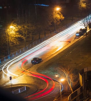Cars moving on the night road.