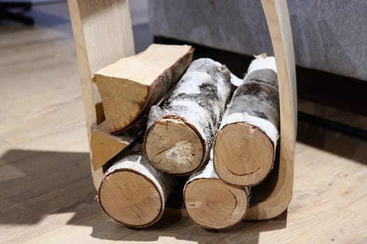 This contemporary log holder beautifully showcases rustic elegance while providing functionality for modern interiors