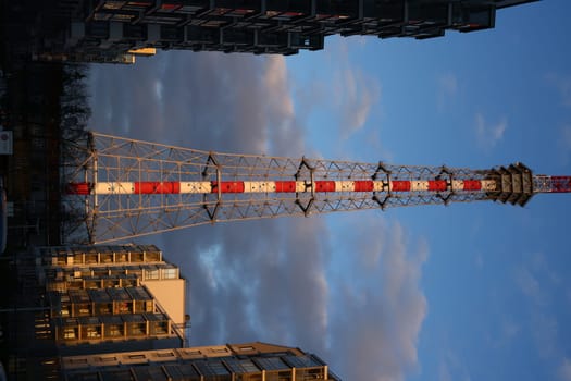 The stunning view captures a telecom tower framed beautifully by various urban buildings against an evocative sky