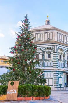 Florence Baptistery in winter with Christmas tree. Italy