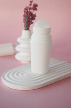 deodorants and cream container on table,