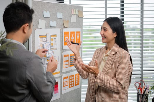 A dynamic team of graphic designers collaborates to create innovative graphics in a modern office setting.